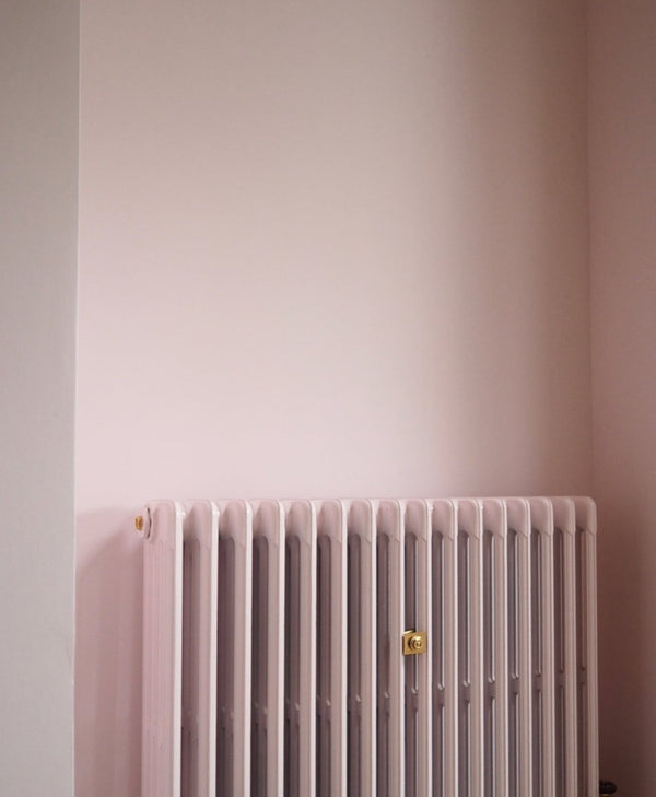 pastel Pink radiator against a light pink wall