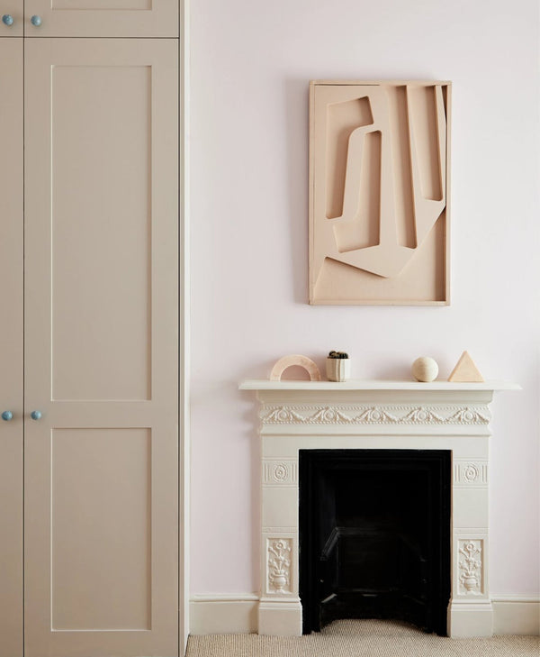 neutral painted room with a fireplace and wardrobe painted in a tonal neutral paint