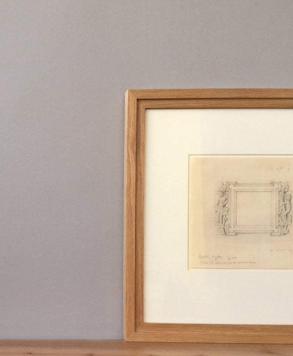 Framed artwork on a mid grey wall