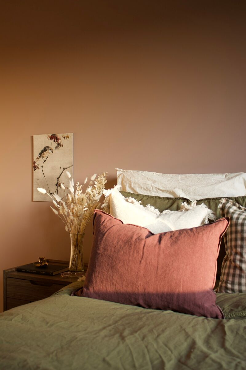 Bedroom walls painted in Mylands Egerton Place, creating an earthy and cozy feel.