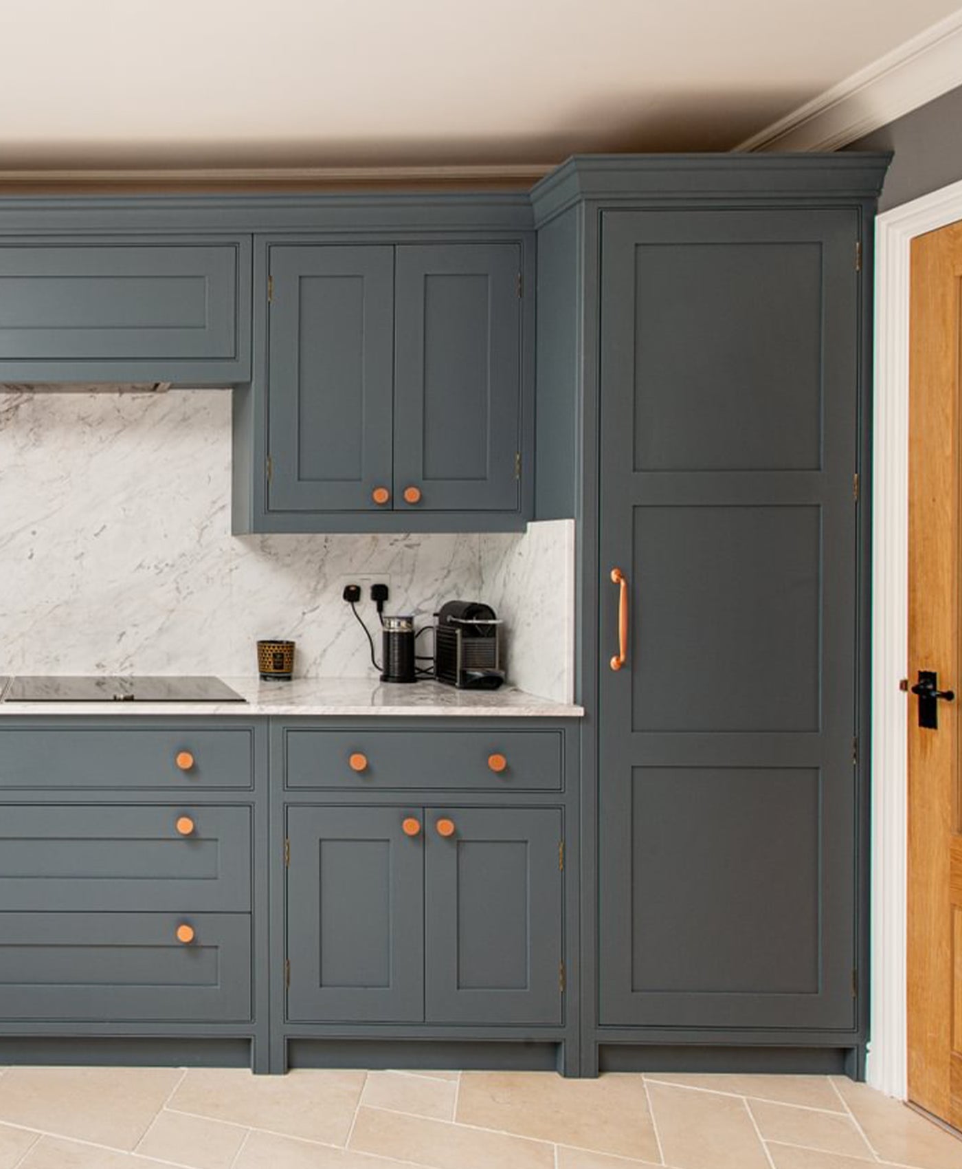 Modern kitchen with dark grey cabinets and marble countertop