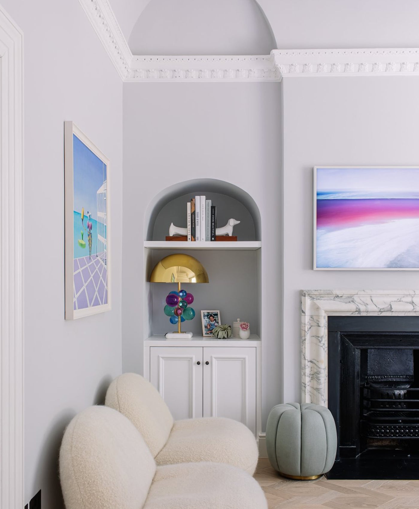 grey neutral painted living room with period features and wooden flooring