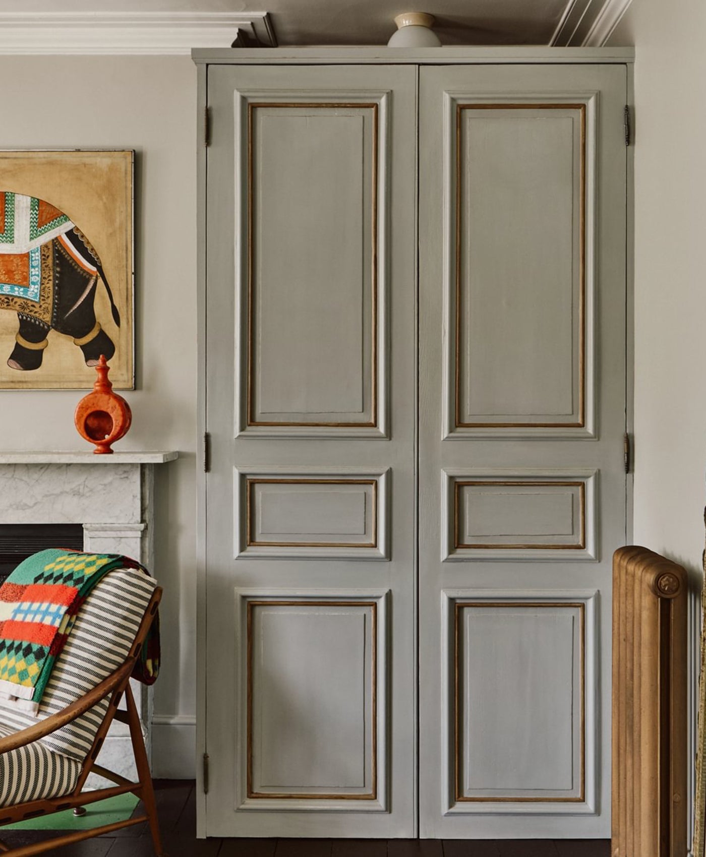 neutral grey wardrobe with decorative elements in a room setting