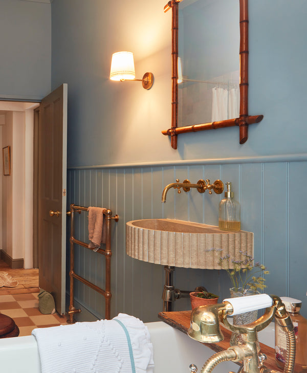 Mylands Bridge Blue No. 222 - Bathroom interior with a sink, mirror, and towel rack.