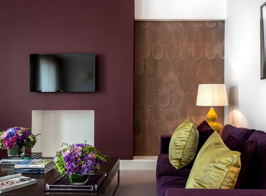 Brown magenta living room wall painted with Rothschild Street No.296